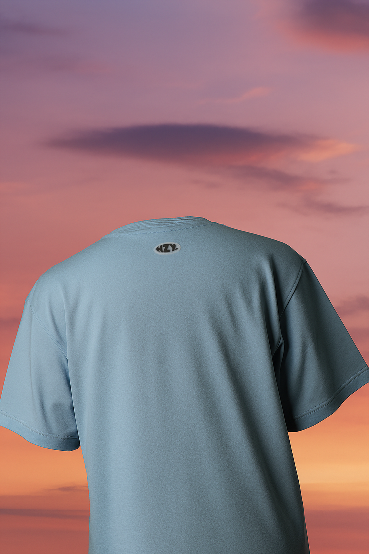 Blue oversized Evolve tee back view, bold puff print graphic